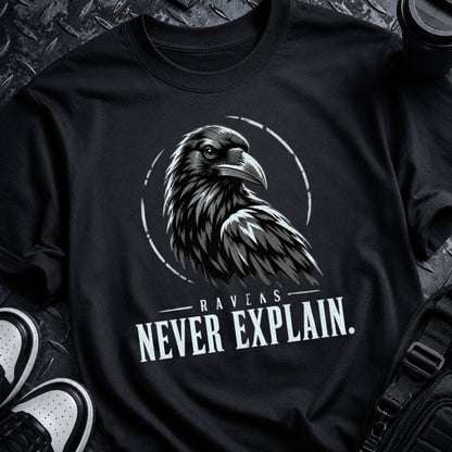Black Raven Code Tee with distressed off-white raven sigil, broken circular ring and RAVENS NEVER EXPLAIN typography.