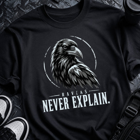 Black Raven Code Tee with distressed off-white raven sigil, broken circular ring and RAVENS NEVER EXPLAIN typography.